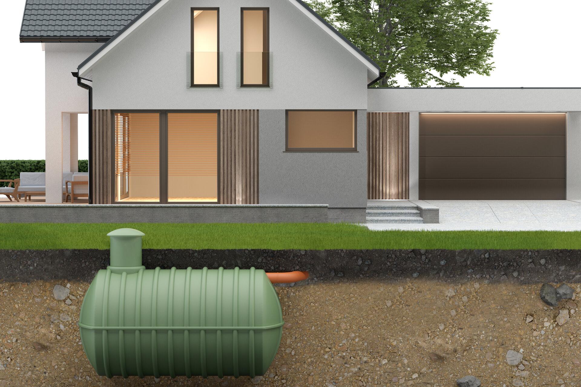 Unterirdischer Abwassertank und Haus mit Bodenbeschneidung